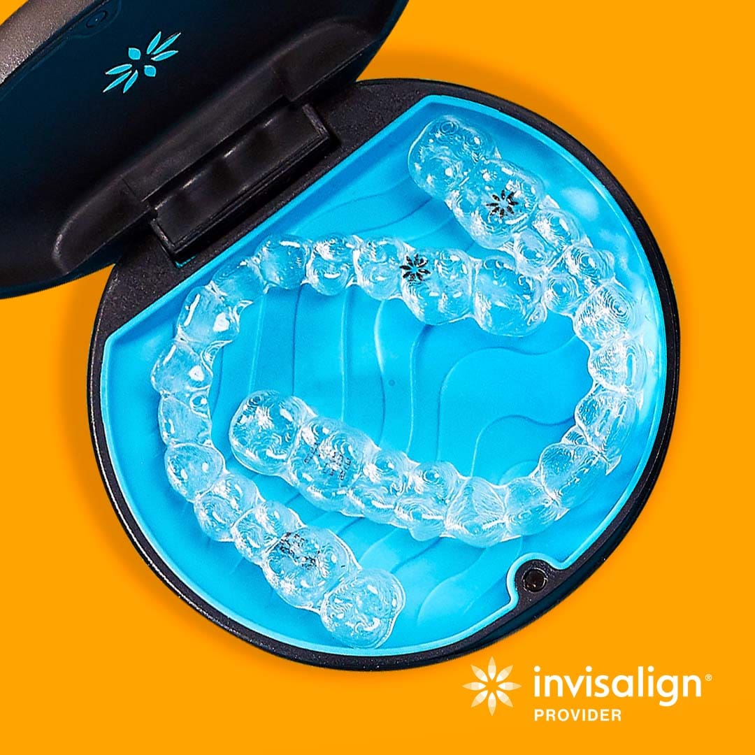 Invisalign clear aligners in their case Custom-made Invisalign aligners in their case, designed for a personalized and effective orthodontic treatment.