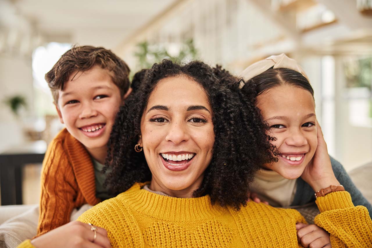 We will help you to determine the coverage you have available and provide you with an estimated benefit Mother and children looking excited about their orthodontic journey, exploring affordable insurance plans.